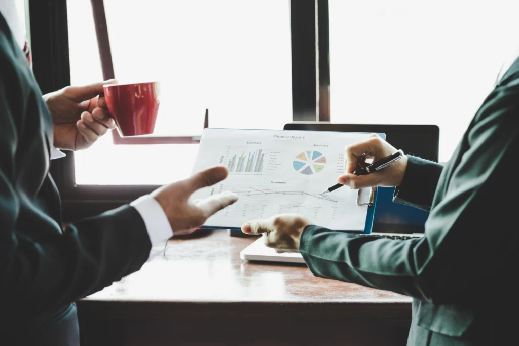 Business team analysing income charts and graphs