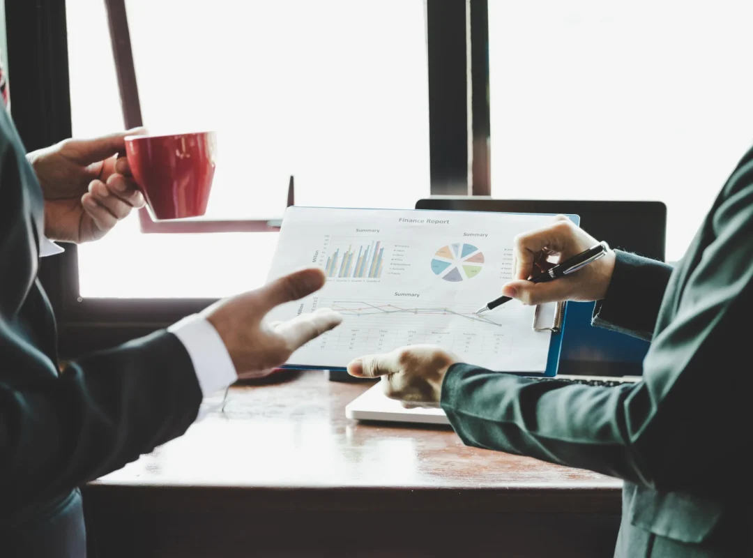 Business team analysing income charts and graphs