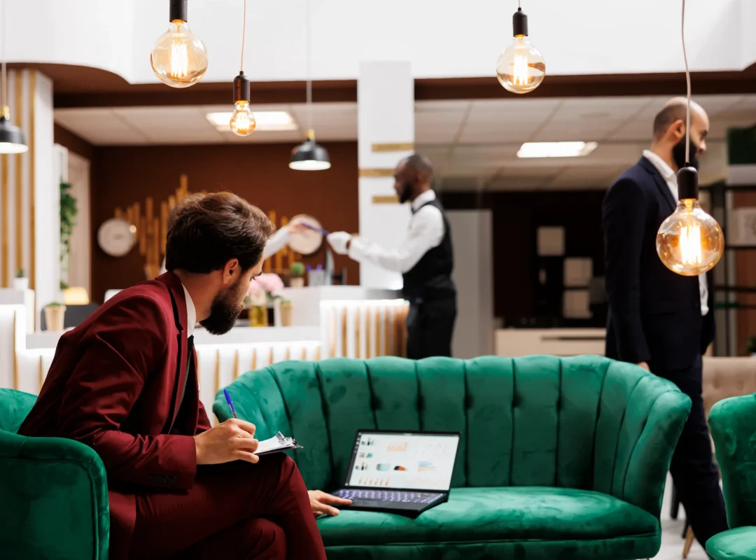 Business professional finding new ideas to forge international partnership before attending conference, hotel lounge area.